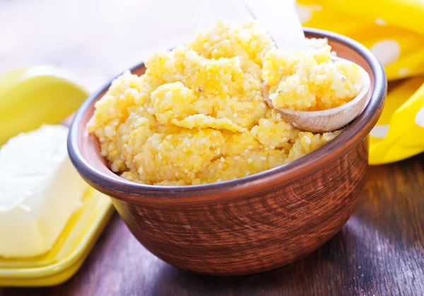 Corn porridge and butter — Stock Photo, Image