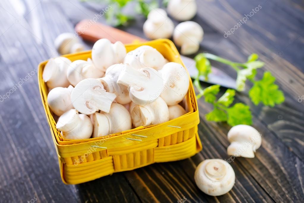 raw mushrooms in basket