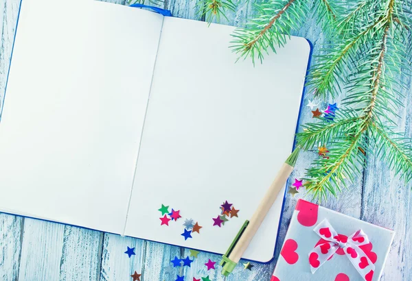 Notebook and christmas decorations — Stock Photo, Image