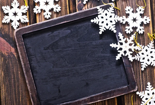 Christmas snowflakes and board — Stock Photo, Image
