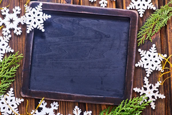 Christmas snowflakes and board — Stock Photo, Image