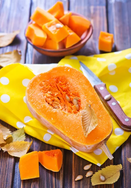 Fresh pumpkin on wooden table — Stock Photo, Image