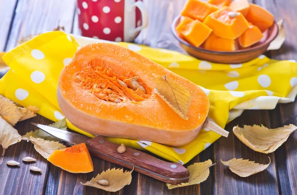 Fresh pumpkin on wooden table — Stock Photo, Image