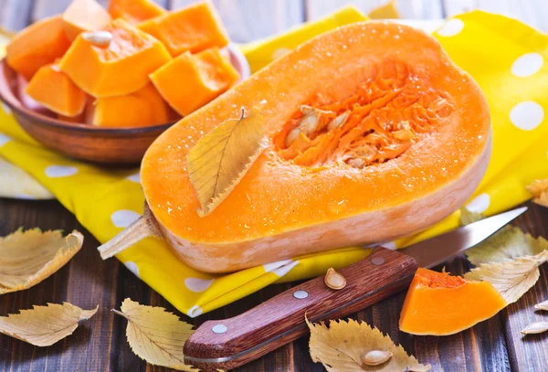 Fresh pumpkin on wooden table — Stock Photo, Image