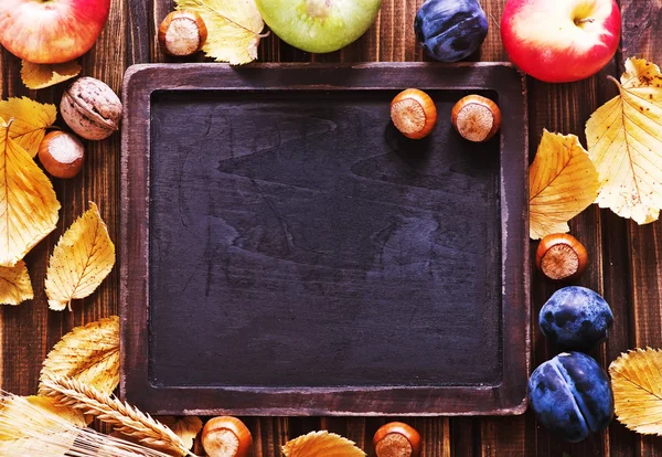 Autumn harvest and chalkboard — Stock Photo, Image