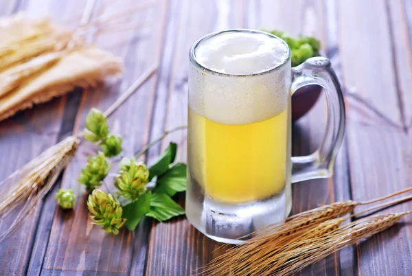 Beer in glass and wheat ears — Stock Photo, Image