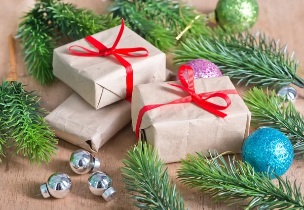 Presents with ribbon and baubles — Stock Photo, Image