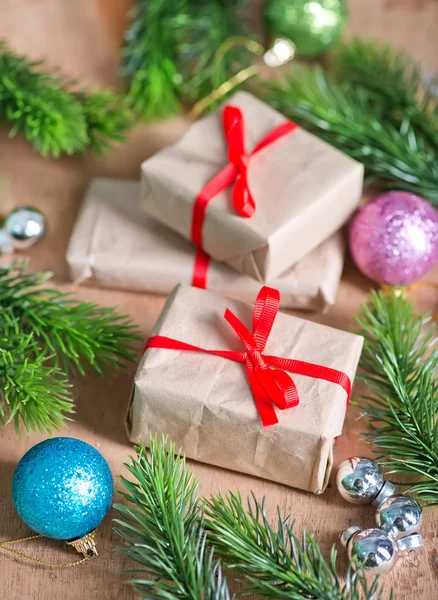 Presents with ribbon and baubles — Stock Photo, Image