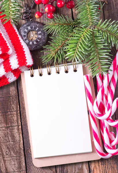 Notebook, candy canes, clock — Stock Photo, Image