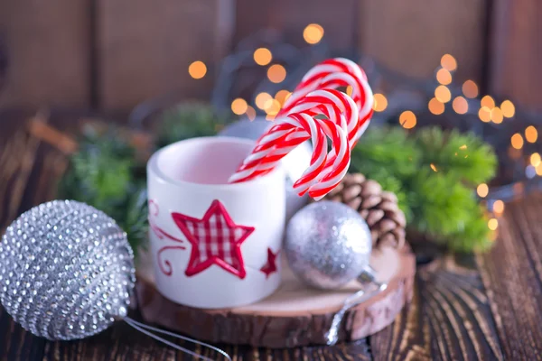 Candy canes in white cup — Stock Photo, Image