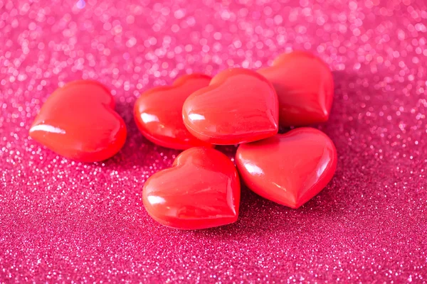 Red hearts on red paper Stock Photo