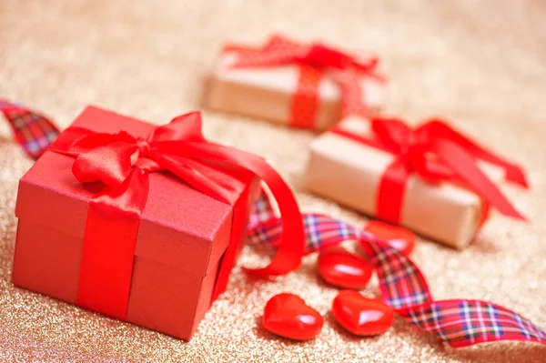 Presents with ribbons and hearts — Stock Photo, Image