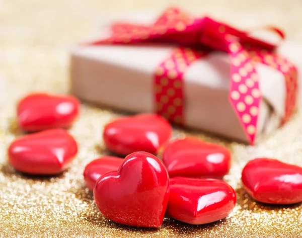 Present with ribbon and hearts — Stock Photo, Image