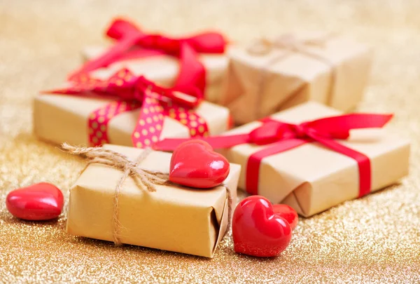 Presents with ribbons and hearts — Stock Photo, Image