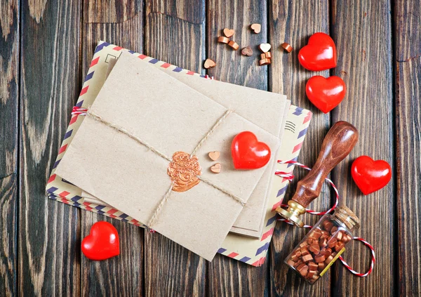 Envelopes and red hearts — Stock Photo, Image