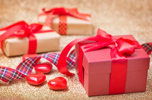 Presents with ribbons and hearts — Stock Photo, Image