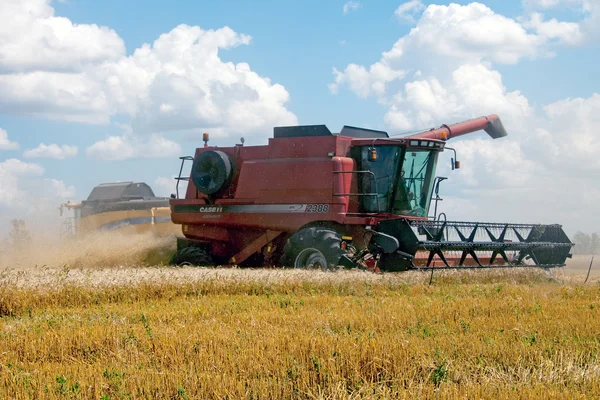 KHARKIV / UKRAINE - JULY 12. Harvesting wheat field in Kharkiv Oblast in the Ukraine in July 12, 2011. Royalty Free Stock Photos