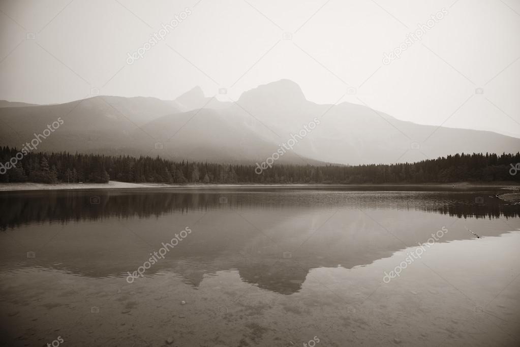 Lake with fog and mountains