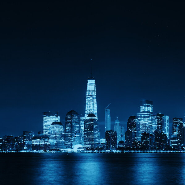 New York City skyline at night with downtown skyscrapers