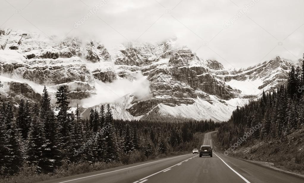 Highway with snow capped mountains