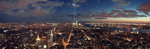 New York City downtown skyline panorama night view with September 11 tribute light..