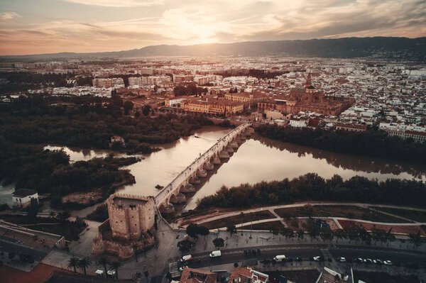 City ancient architecture of Cordoba viewed from air at sunset in Spain.