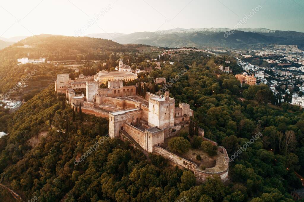Alhambra aerial view at sunrise with historical buildings in Granada, Spain.
