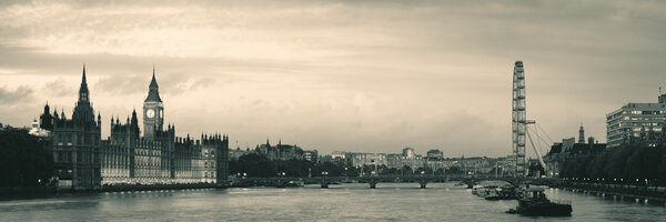 Thames River panorama with London Eye and Westminster Palace in black and white in London.