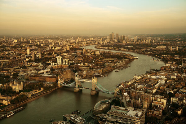 London rooftop view panorama at sunset with urban architectures and Thames River.
