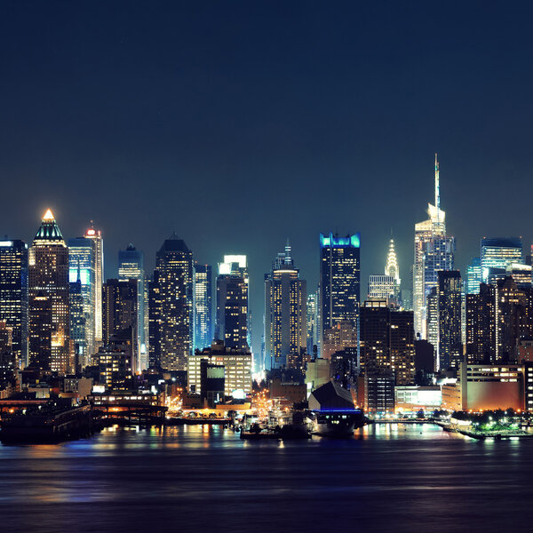 Midtown Manhattan skyline at dusk panorama over Hudson River