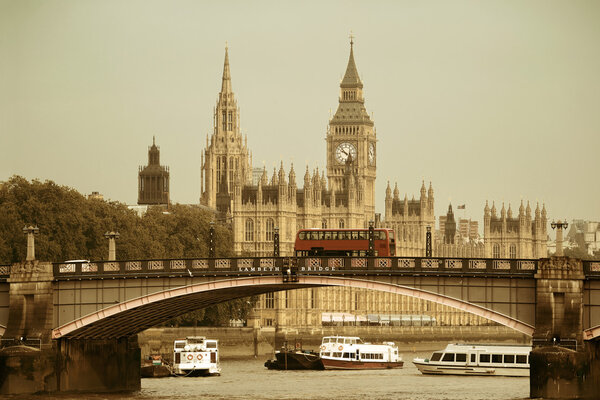 Big Ben, House of Parliament and Lambeth Bridge with red bus in London.