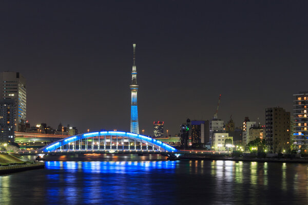 Tokyo Skytree and the Eitai bridge in Tokyo at dusk