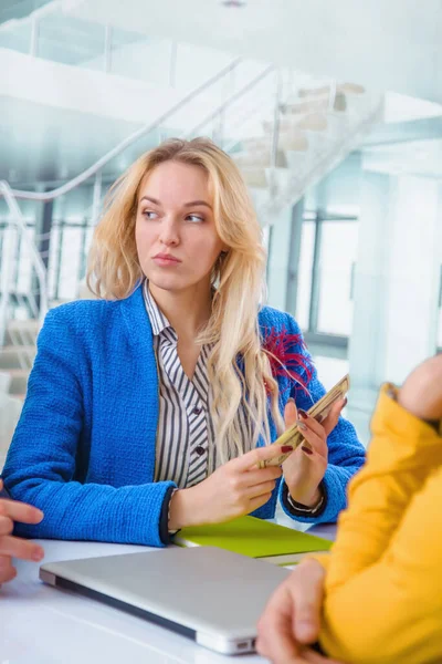 Business, money and teamwork concept. Humorous image of beautiful female top manager counting profits.