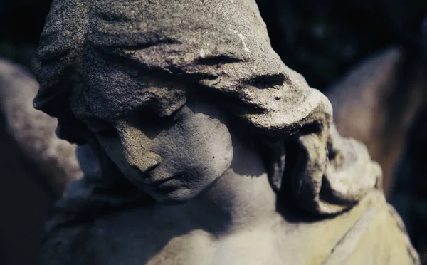 Sad eyes of beautifuul angel. Ancient statue. Death, pain and end of life concept.