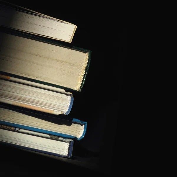 Books on a dark background — Stock Photo, Image