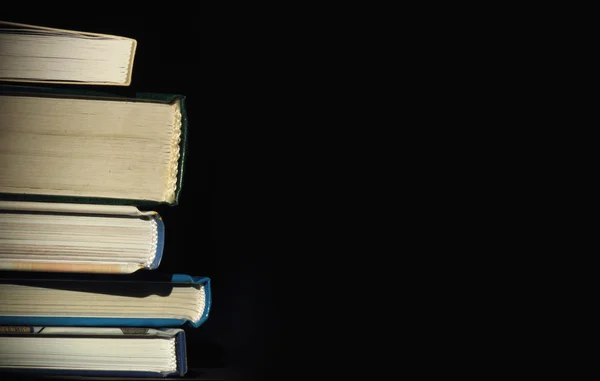 Books on a dark background — Stock Photo, Image