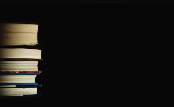 Stack of books on the black background — Stock Photo, Image