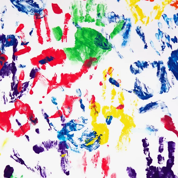 Huellas de manos coloridas en el fondo blanco — Foto de Stock