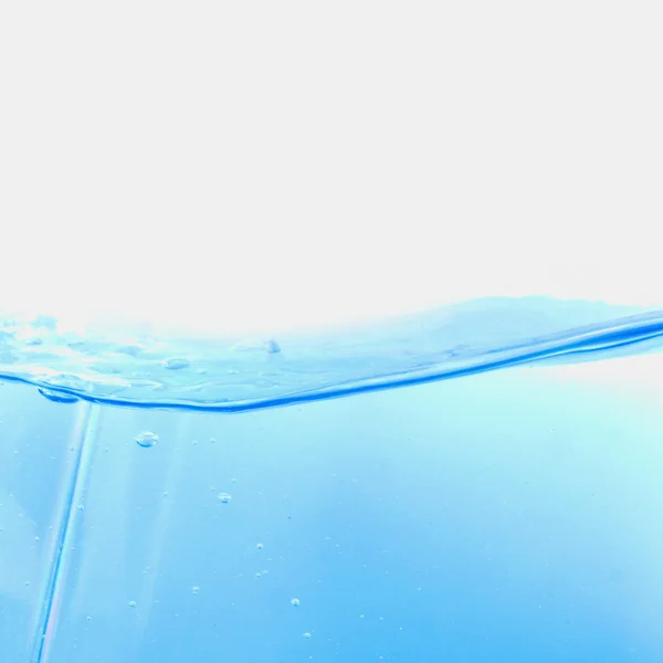 Abstract water splash met golven en de bubbels. — Stockfoto