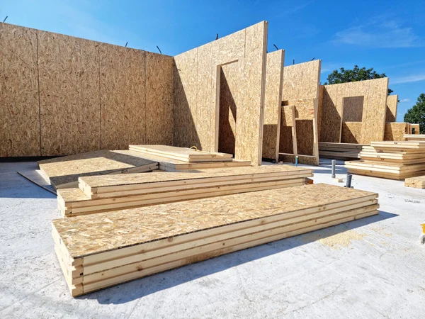 Construction of new and modern prefabricated modular house from composite wood panels. Energy efficient panel assembling