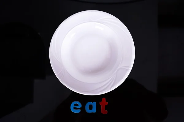 White Plate isolated on Black background — Stock Photo, Image