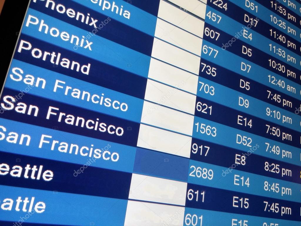 Arrivals display board at airport terminal