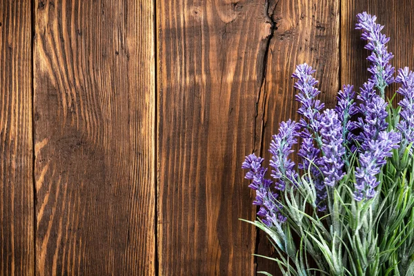 Dried flowers on rustic wooden planks background — Stock Photo