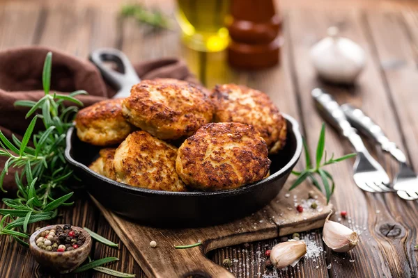 Meat cutlets on frying pan — Stock Photo, Image