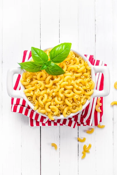 Raw pasta in a bowl — Stock Photo, Image