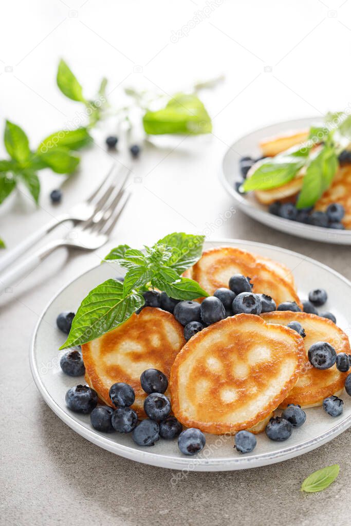 Fritters, pancakes with fresh blueberry
