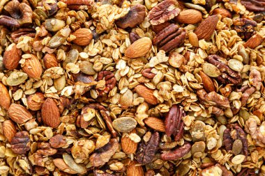 Granola arka plan, kahvaltıda fındıklı müsli, sağlıklı yemek, diyet.