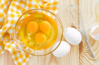 Raw eggs and whisk clipart