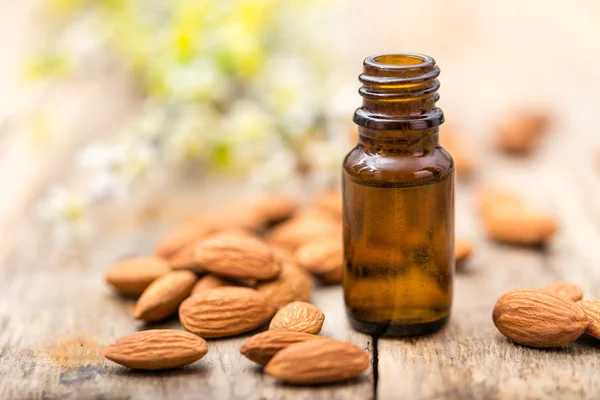 Almond oil in a bottle — Stock Photo, Image