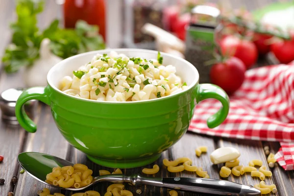 Raw pasta in a bowl — Stock Photo, Image